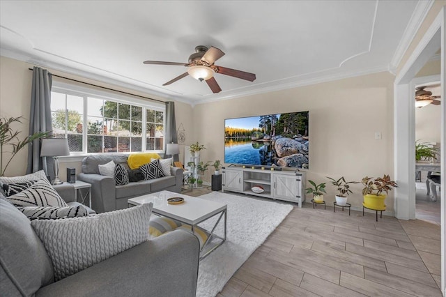 living room with crown molding and ceiling fan