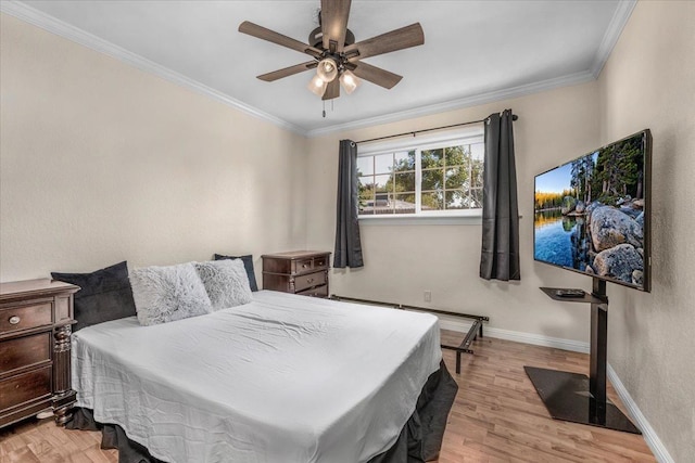 bedroom featuring ceiling fan, ornamental molding, and light hardwood / wood-style flooring