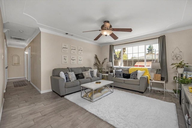 living room featuring ornamental molding, ceiling fan, and light hardwood / wood-style floors