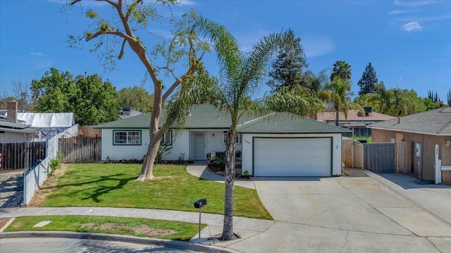 single story home featuring a garage and a front yard