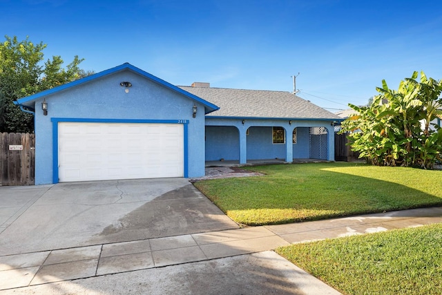 ranch-style house with a garage and a front lawn