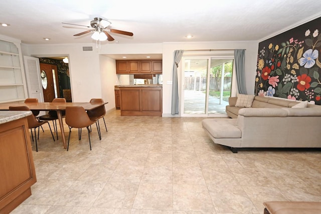 living area with recessed lighting, ceiling fan, visible vents, and ornamental molding