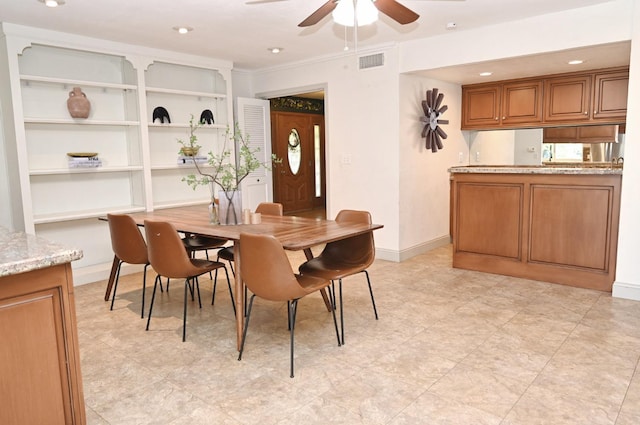 dining space with built in features, baseboards, visible vents, a ceiling fan, and recessed lighting