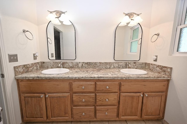 bathroom featuring double vanity and a sink