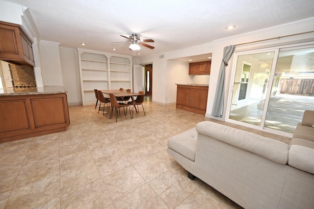 living area with ceiling fan, visible vents, baseboards, and recessed lighting