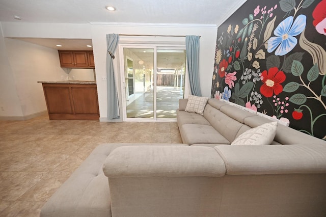 living room with ornamental molding, recessed lighting, and baseboards