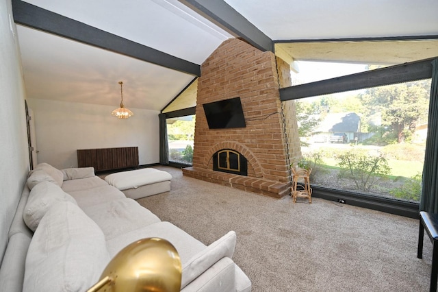 living room with vaulted ceiling with beams, a fireplace, and carpet flooring