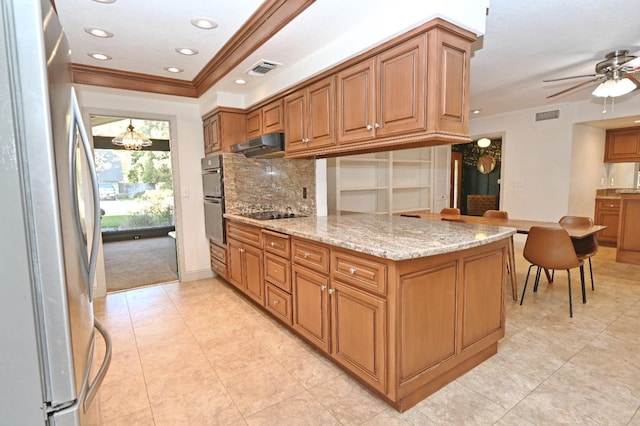 kitchen featuring ornamental molding, visible vents, under cabinet range hood, and black appliances