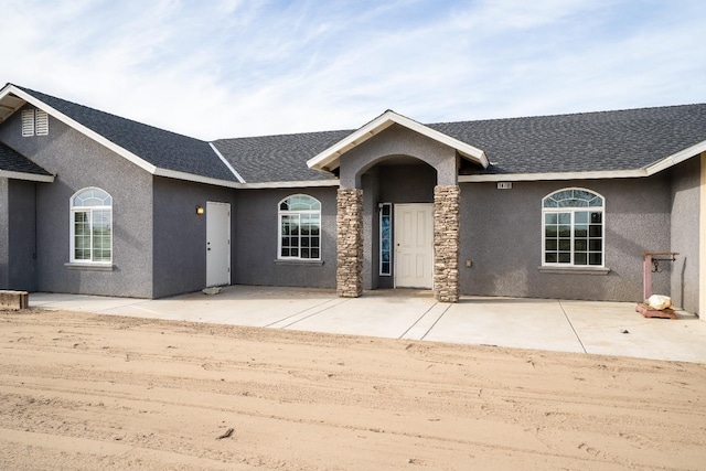 ranch-style house with a patio