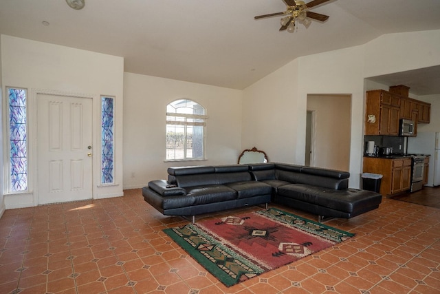 living room featuring ceiling fan and lofted ceiling