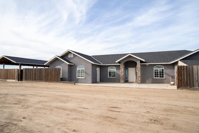 ranch-style home with a patio