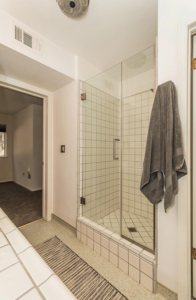 bathroom with walk in shower