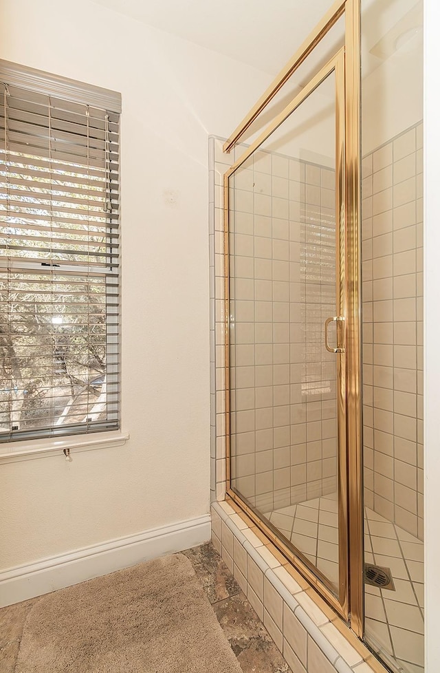 bathroom featuring an enclosed shower