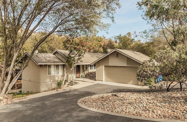 single story home featuring a garage