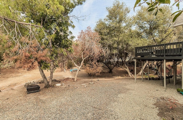 view of yard featuring a wooden deck