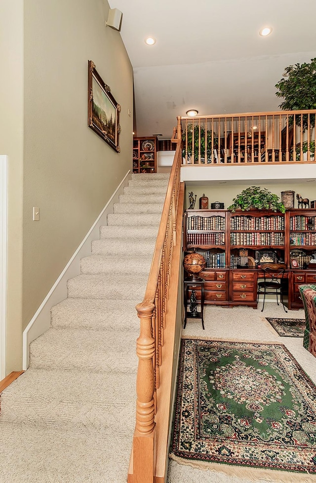 stairs with built in desk and carpet floors