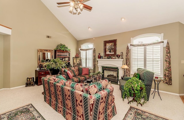 carpeted living room featuring high vaulted ceiling and ceiling fan