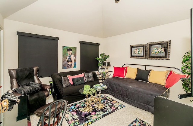 carpeted living room with vaulted ceiling