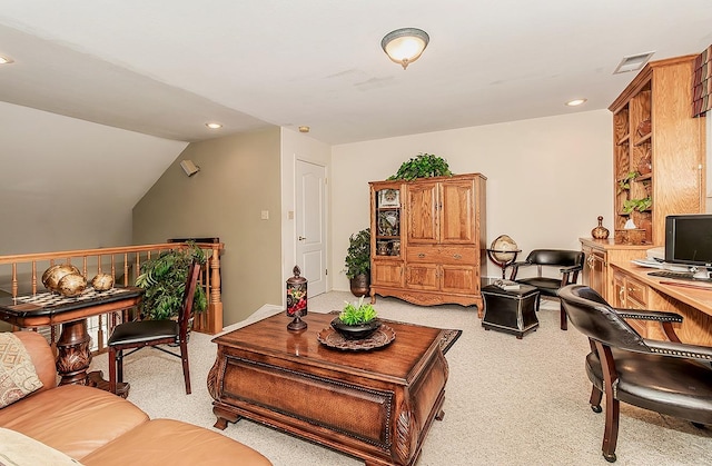 living room featuring lofted ceiling and light colored carpet