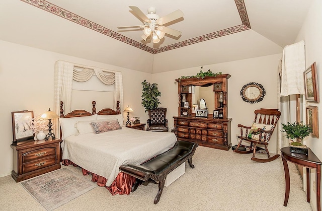 carpeted bedroom featuring ceiling fan and vaulted ceiling