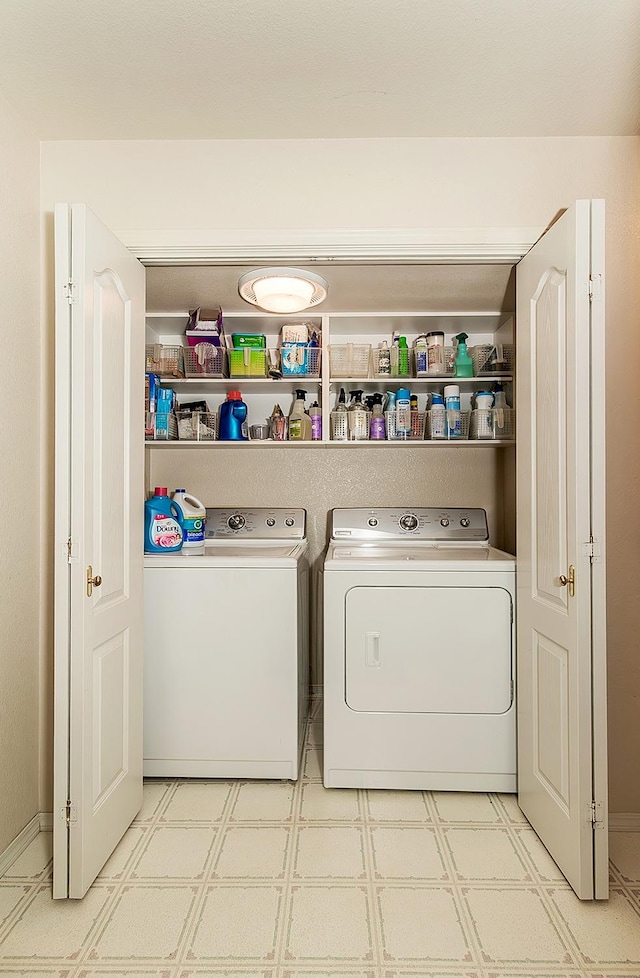 clothes washing area featuring separate washer and dryer