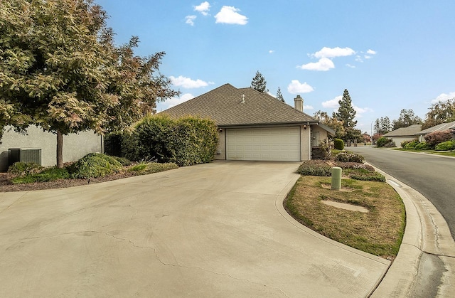 view of side of home featuring a garage