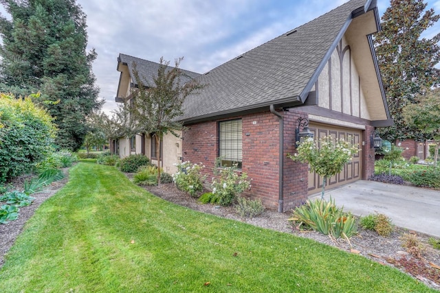 view of side of home with a lawn