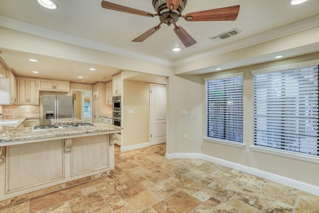 kitchen with a kitchen breakfast bar, backsplash, ornamental molding, light stone countertops, and appliances with stainless steel finishes