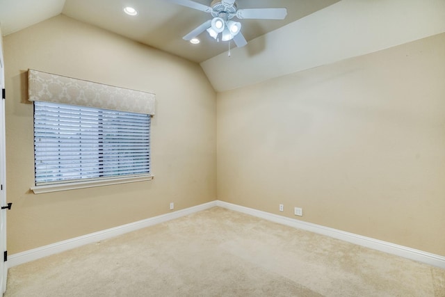 unfurnished room with light carpet, lofted ceiling, and ceiling fan