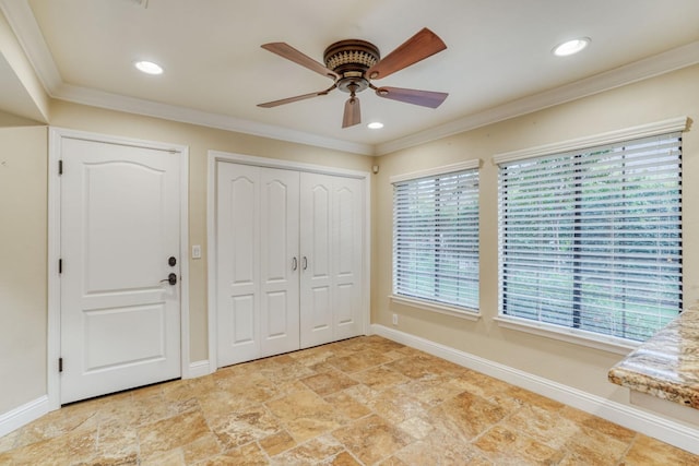 unfurnished bedroom featuring ceiling fan, crown molding, and multiple windows