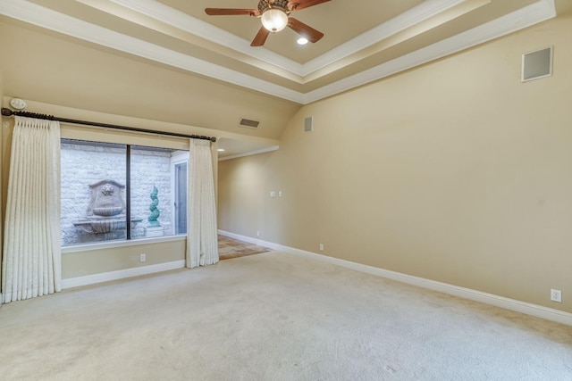 empty room with crown molding and light colored carpet