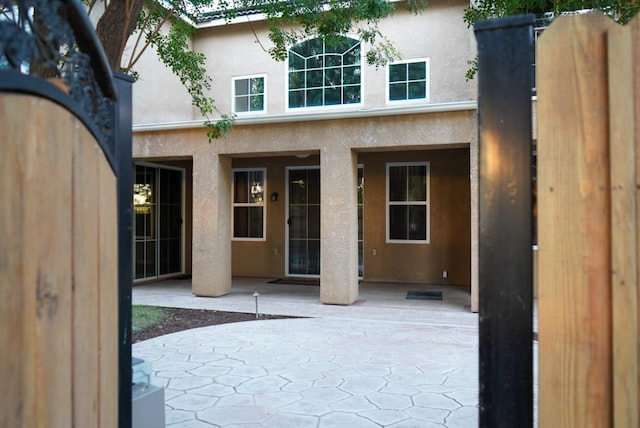 entrance to property with a patio area