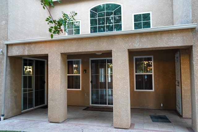 property entrance with a patio