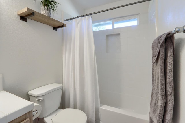 full bathroom featuring toilet, shower / bath combo, and vanity