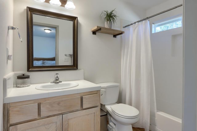 full bathroom with toilet, vanity, and shower / bath combination with curtain