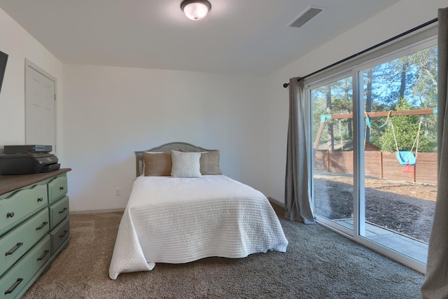 carpeted bedroom with access to exterior