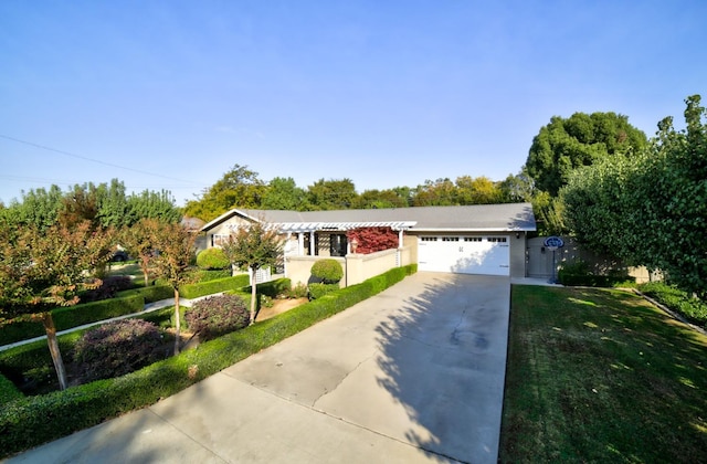 ranch-style house with a front yard and a garage