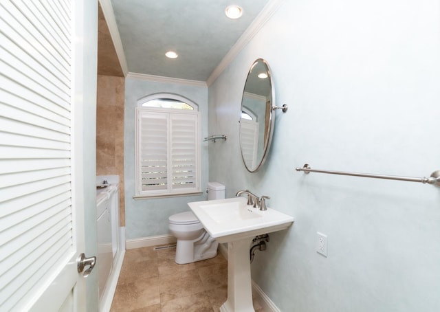 bathroom with crown molding, toilet, and tile patterned flooring