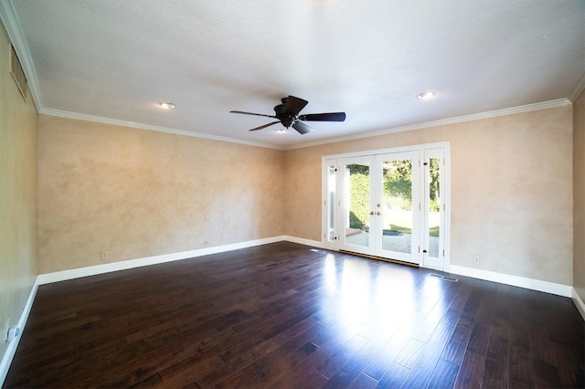 empty room featuring french doors, ornamental molding, dark wood-type flooring, and ceiling fan