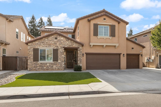 view of front of house with a front lawn and a garage