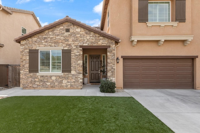 view of front property with a garage and a front lawn