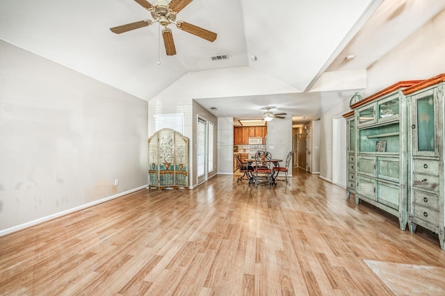 interior space with ceiling fan, light hardwood / wood-style floors, and lofted ceiling