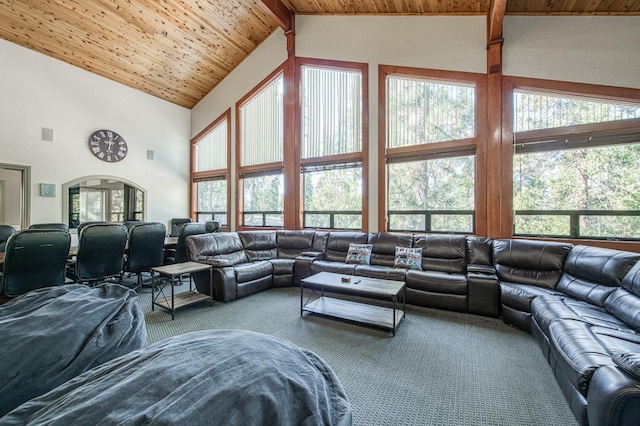 living room featuring wooden ceiling, beam ceiling, carpet flooring, and high vaulted ceiling