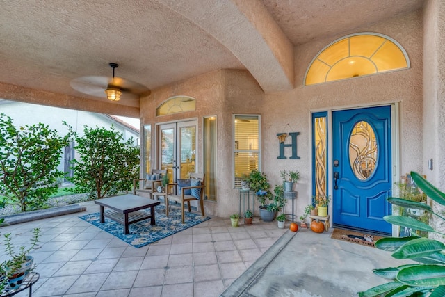 property entrance featuring a patio area