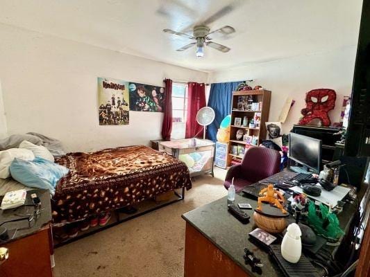 3819 E Belgravia Ave, Fresno, CA 93725 - bedroom with an office area, carpet, and a ceiling fan