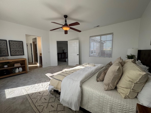 bedroom with ceiling fan and carpet floors