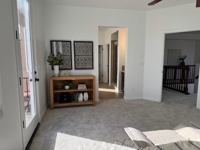 interior space featuring ceiling fan