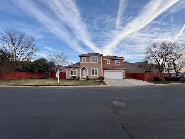 view of front of home with a garage and a front lawn