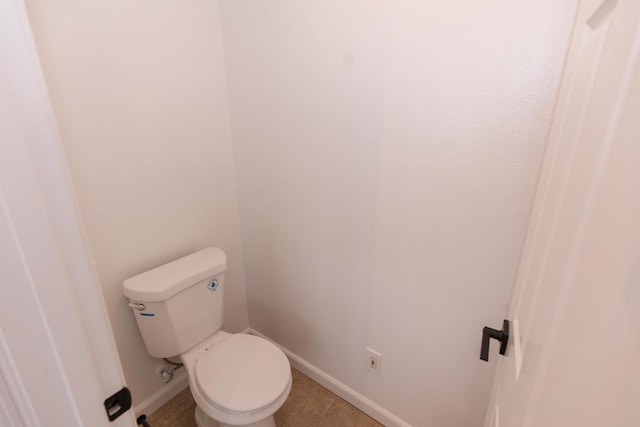 bathroom featuring tile patterned floors and toilet