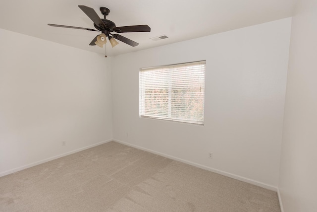 carpeted empty room with ceiling fan